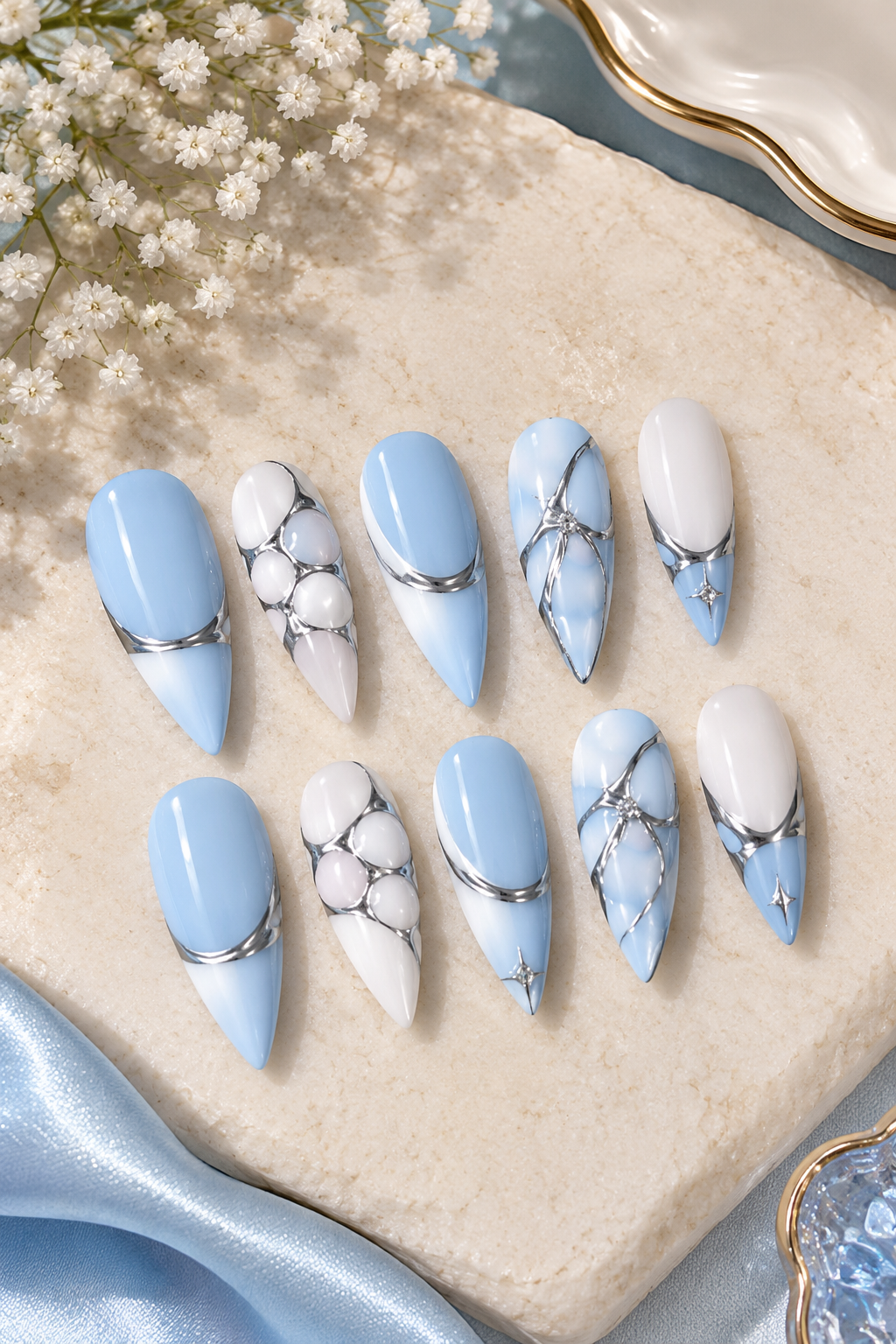 Baby blue and chrome stiletto nails